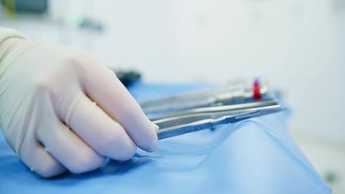 Surgical Tools Arranged on Blue Sterile Drape