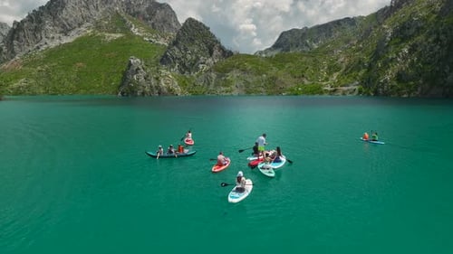 Aerial Video of People Enjoying SUP in Canyon