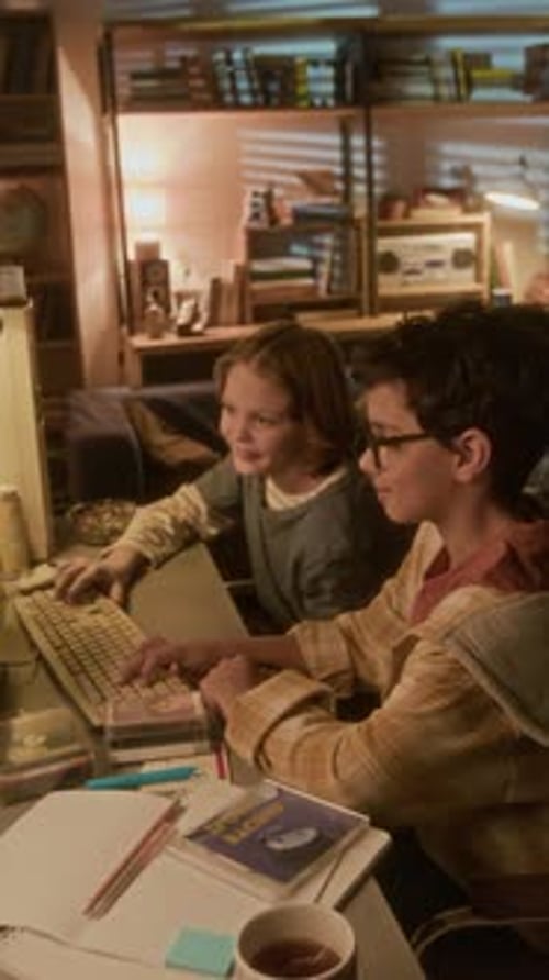 Boy and Girl Using Retro Computer at Home