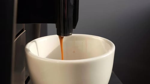 Coffee Machine Dispenses Fresh Coffee into Mug
