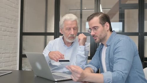 Business People Enjoying Online Shopping in Office