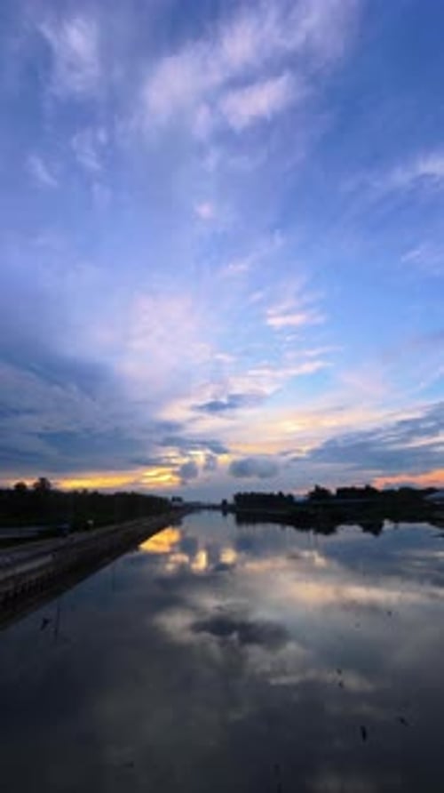 Colorful Sunset Reflecting in a River, Vertical Orientation