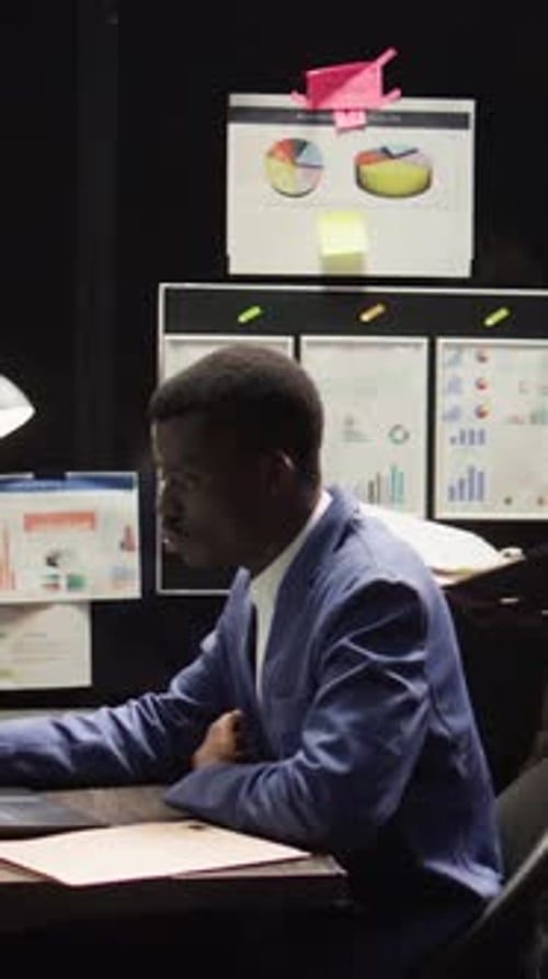 Vertical Video Law Officers Analyze Evidence in Office