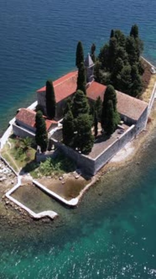 Perast, Boka Kotorska, Montenegro. Vertical Drone Shot of Saint George Islet and Monastery