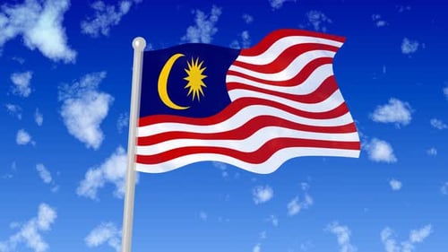 Malaysia National Flag Waving in a Blue Sky