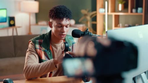 Streamer, camera and headset with man in studio for review, tech advice and broadcast