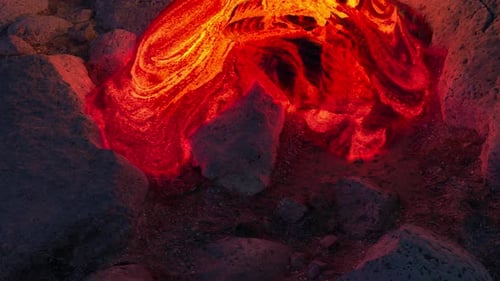 Vibrant Molten Lava Flow on Rugged Rocky Terrain