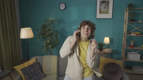 Young Adult Dancing Expressively Listening to Music