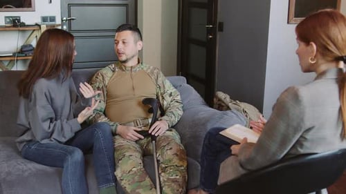 A Sad Married Couple a Soldier and His Wife Talk About Divorce and Argue in a Psychologist's Office