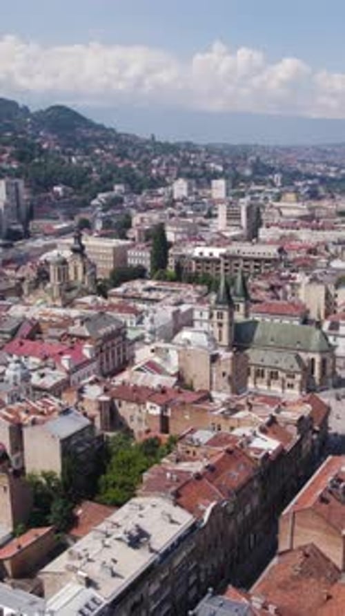 Sarajevo cityscape featuring Sacred Heart Cathedral and surrounding buildings. Aerial