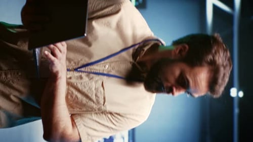 Man Works Late on Laptop in Blue Lit Office