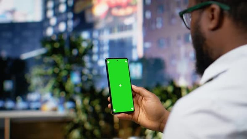 Green Screen on Laptop Held By Black Man on the City Center Streets ...