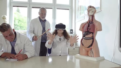 Senior Teacher Teaching Biology to High School Students