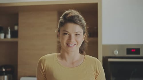 Smiling Woman in Kitchen