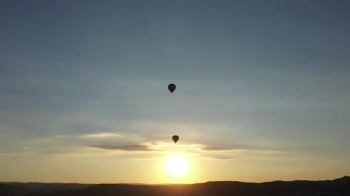 Hot Air Balloons Rising at Sunrise