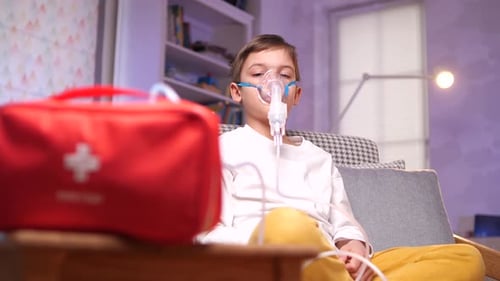 Child Using Nebulizer Mask for Respiratory Treatment