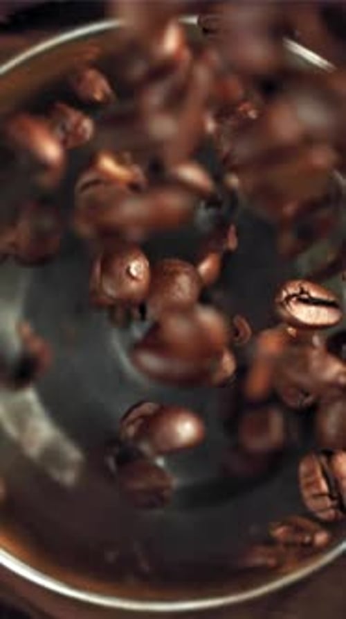 The Coffee Beans Fall Into the Working Grinder Filmed on a Highspeed Camera at 1000 Fps
