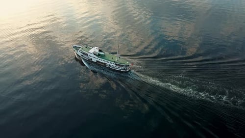 A ferry sailing on a beautiful blue sea in the background