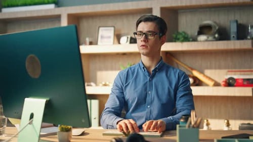 Focused Businessman Texting Computer Keyboard at Office Closeup. Eyeglasses Serious Man Working