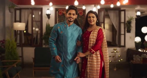 Stylish Couple Posing Together in Backyard at Night