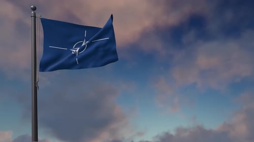 Animated NATO Flag Waving on a Pole Against a Blue Sky