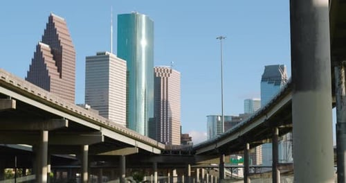 Establishing shot of downtown Houston from freeway underpass