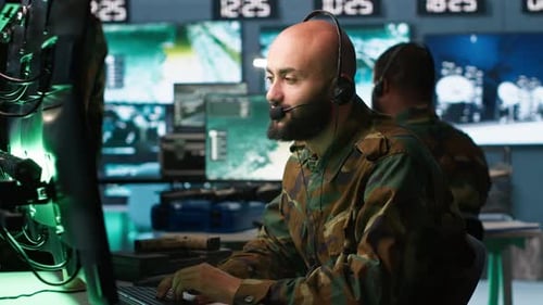 Soldier Solving Tasks in Military HQ Base Gathering Information on Enemy Troops