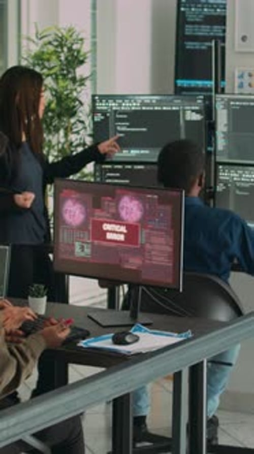 Team Discussing Critical Error in Modern Office