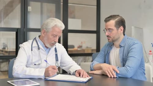 Doctor Consults with Patient in Office Setting