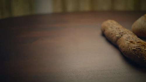 Loaves of Fresh Bread Displayed on Table
