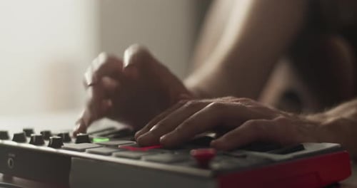 Adult Hands Use Beat Machine To Make Music
