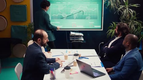Team Discusses Data at Conference Table