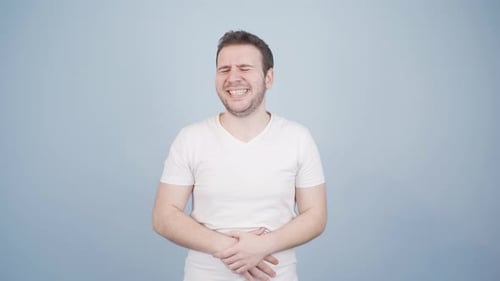 Man experiencing stomachache.