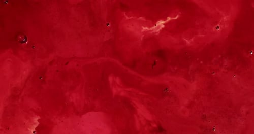 Red Liquid Swirls from Bottom to Center