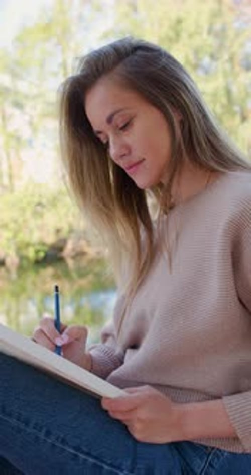 Closeup Footage of a Woman Artist Drawing Outdoor