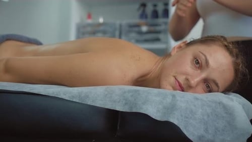 Woman Receiving Relaxing Back Massage at Spa
