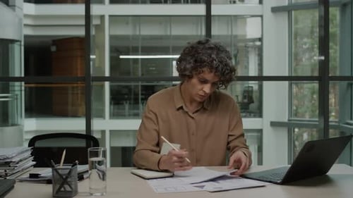 Businesswomans Work Routine in Office