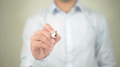 Hand Writes Process with Marker on Clear Surface