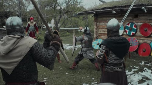 Medieval Soldiers Engaging in a Mock Sword Battle