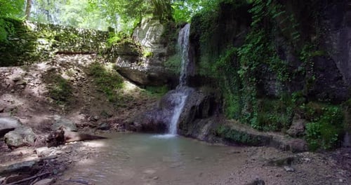 a small waterfall in a forrest