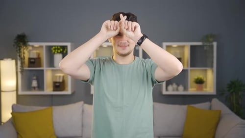 Man making a happy and peaceful frame sign.
