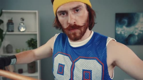 A Playful Retro Athlete in a Colorful Headband and Jersey Exuding Fun During Activities