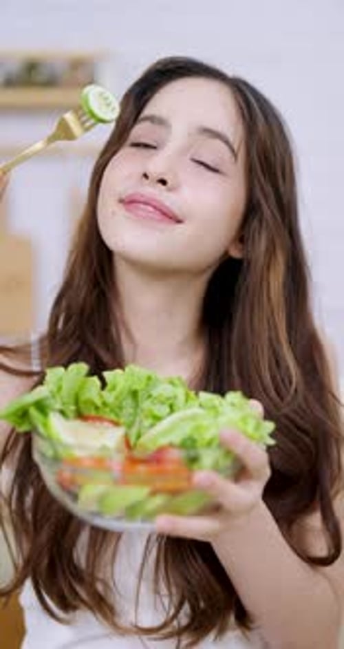 Happy Young Woman Eating Fresh Healthy Salad