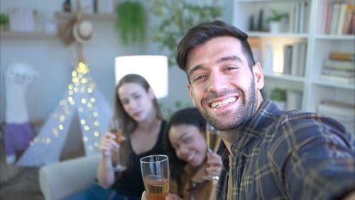Multiethnic friends had fun party and drinking wine at home.