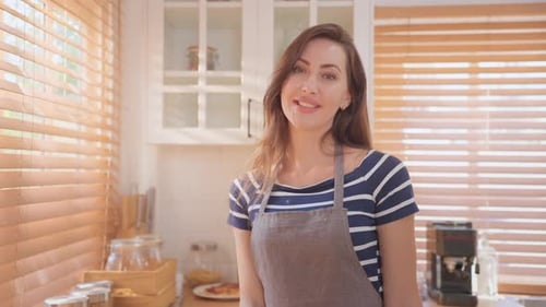 Portrait of Caucasian young woman baking bakery in kitchen at home.
