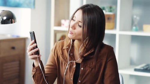 Woman Listening to Music at Home