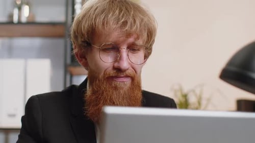 Closeup Businessman Freelancer at Office Workplace Working on Laptop Computer Sends Online Messages