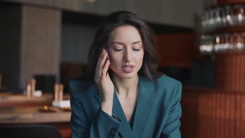 Close Up of Young Beautiful Caucasian Woman Using Cell Phone Talking Portrait of Focused Manager