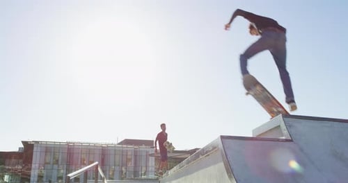 Men, people and jump with skateboard outdoor at park for sport, freedom