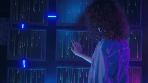 Young Adult Interacting With Futuristic Computer Code